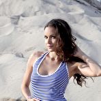 First pic of Stunning And Busty Girl Strips In The Sand