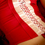 Third pic of Elle B - Elle B takes her sexy red lingerie on the bed and fingers her hungry vagina.