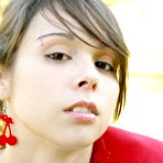 First pic of Ariel Rebel - Sporty and sexy Ariel Rebel lies down on a lawn and shows her clean shaved pussy.