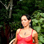 First pic of Heavy hanging shemale oils up her big titties