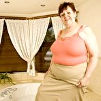 First pic of BBW Dorothy plays with extra mega melons in sexy lingerie