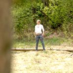 Fourth pic of Nice ass blonde babe with shaved pussy takes a piss outdoors