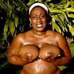 Second pic of Total plumper ebony exposes her big heavy hooters outdoors