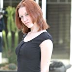 First pic of Smokie Flame - Sexy redhead babe Smokie Flame posing on the street wearing a cute blcak skirt