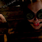 Fourth pic of SexPreviews - Charlie Ann redhead bent over bound in wooden stocks her ass spanked red