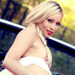Fourth pic of Brea Bennett fingering her flawless pussy on top of her classic car