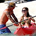 First pic of Audrina Patridge shows deep cleavage in green bikini when relaxing on a tropical vacation