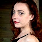 First pic of SexPreviews - Maggie Mead bound in wooden stock her shaved and pierced pussy vibrated