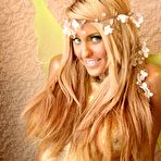 Second pic of Ember Reigns - Smoking hot blonde model Ember Reigns poses nude for the camera and shows her boobs.