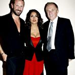 Third pic of Salma Hayek slight cleavage in red dress at Yves Saint Laurent fashion show