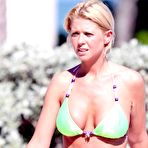 Fourth pic of Tara Reid shows deep cleavage in green bikini
