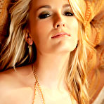 Second pic of 
      Sara Jaymes fondles her sweet pussy on the sofa
    