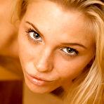 Second pic of Heather Wild - Heather Wild strips her sexy white panties off on the sofa and fingers her muff.