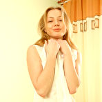 Third pic of Irina H - Irina H strips all of her clothes on the bed and shows us her small perky tits.