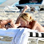 Fourth pic of Claudia Galanti sunbathing topless on the beach in Miami