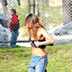 Third pic of Rosy Dilettuso sunbathing topless in the park