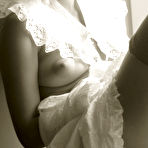 Second pic of Koika - Koika takes her vintage clothes off and teases us in sexy stockings on the chair.