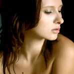 Third pic of Lena L - Lena L takes her clothes off on the bed and shows us her perky round boobs.