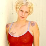 First pic of Megan FTV - Seductive blonde chick Megan FTV pulls down her red thongs and shows her shaved cunt.