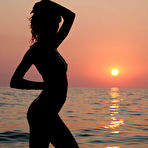 Second pic of Nastya A - Nastya A goes on a beach early in the morning to enjoy a naked swim freely.