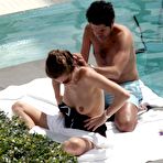 First pic of French journalist and TV presenter Melissa Theuriau topless on a beach and poolside paparazzi shots