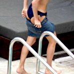 Fourth pic of French journalist and TV presenter Melissa Theuriau topless on a beach and poolside paparazzi shots