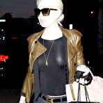 Fourth pic of Lindsay Lohan without bra under see thru top