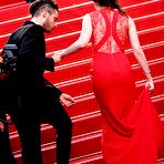 Third pic of Kristen Stewart posing in red dress at Cosmopolis Premiere