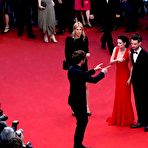 Fourth pic of Kristen Stewart posing in red dress at Cosmopolis Premiere