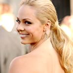 Second pic of Laura Vandervoort in short red dresses shows her legs