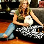First pic of Carmen Electra posing in home with her doggies