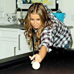 Fourth pic of Carmen Electra non nude posing ib various apartments photoshoots