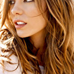 Second pic of kate beckinsale lying on a bed in white sexy dress @ 12pix