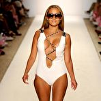 First pic of Busty Adrienne Bailon shows cleavage at fashon show