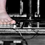 First pic of Naked handcuffed slave girl Alyssa standing on the electrified floor in the dungeon.