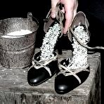 First pic of Tied up slave girl Carrie stands still for hours with rice in her high heel shoes.
