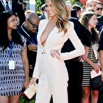 Third pic of Christine Teigen without bra under white jacket