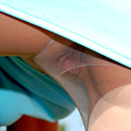 Second pic of Awesome blonde chick pulling on her flesh-colored pantyhose in weird way