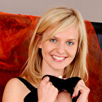 Second pic of Bella Anne - Horny blonde gal Bella Anne spreads her legs and fingers her shaved wet cunt.