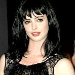 First pic of Krysten Ritter posing in short black dress