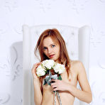 First pic of Slim red haired cutie poses naked on a chair showing her tiny boobies and her bald snatch. - TheMetArt.com