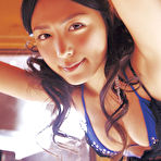 Second pic of Cute asian babe in a purple bikini shows her big massive boobs