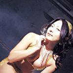 Fourth pic of Cute asian babe in a purple bikini shows her big massive boobs