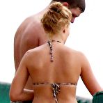First pic of Margot Robbie wearing a bikini on a beach