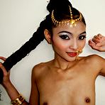 Second pic of Skinny Thai girl Eaw stripping outdoors to show off her slender body