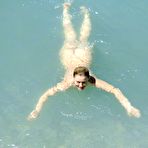 Fourth pic of Nude Beach. They are naked and happy