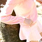 First pic of Naughty tramp in pink quickly flashes pussy