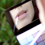 First pic of Beautiful long haired honey with juicy breasts posing in the nude outdoors in the field.