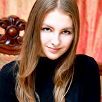 First pic of Izabel A poses so naturally on the elegant sofa showcasing her innocent and cute face, and youthful, delectable body.