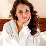 First pic of Sweet-smiling Conchita with her pretty face and voluptuous body posed naked on top of the bed